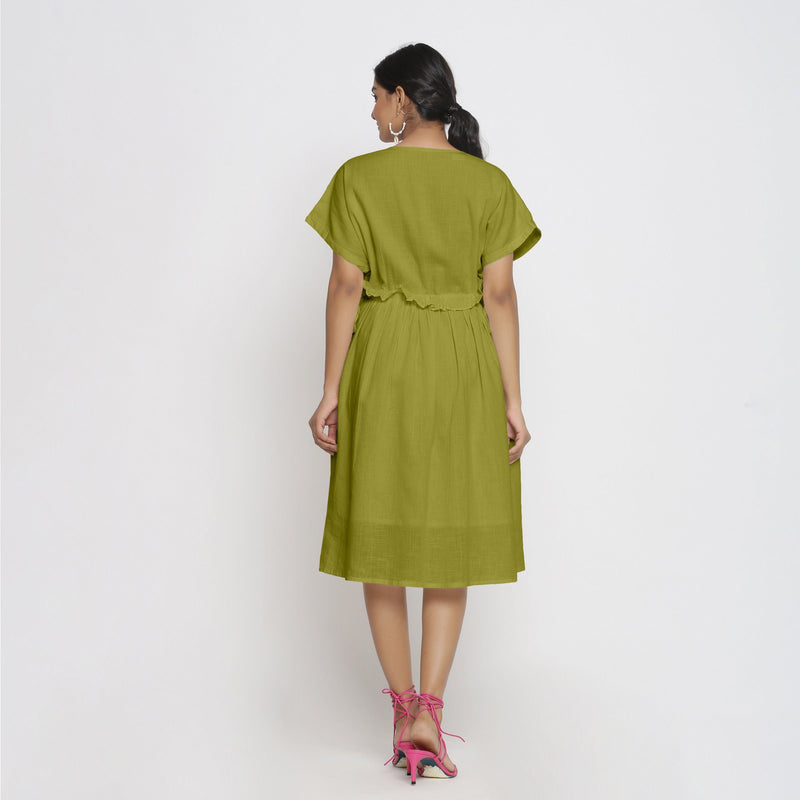 Back View of a Model wearing Olive Green Deep Neck Bohemian Frilled Dress