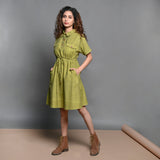 Left View of a Model wearing Olive Green Handspun Cotton Short Safari Dress