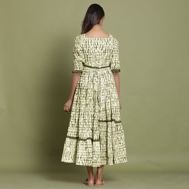 Back View of a Model wearing Olive Green Shibori Asymmetrical Tier Maxi Dress