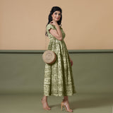 Right View of a Model wearing Olive Green Shibori Elasticated Gathered Dress