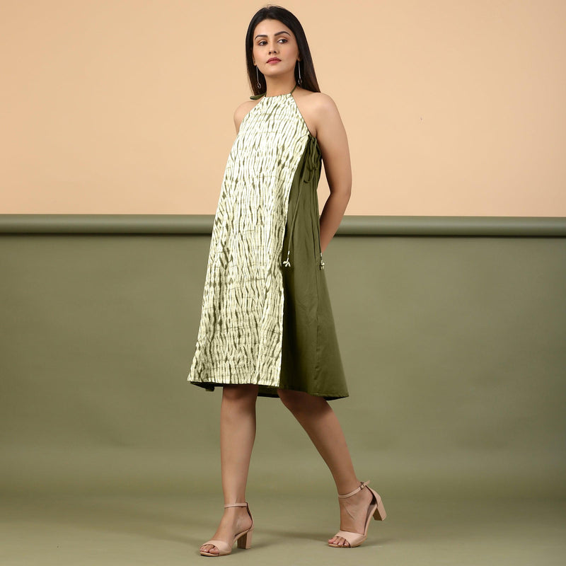 Left View of a Model wearing Olive Green Shibori Halter Neck A line Dress