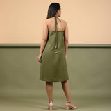 Back View of a Model wearing Olive Green Shibori Halter Neck A line Dress