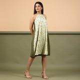 Right View of a Model wearing Olive Green Shibori Halter Neck A line Dress