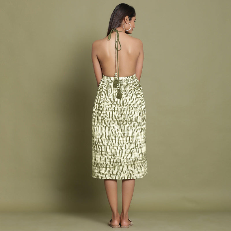 Back View of a Model wearing Olive Green Shibori Halter Neck Gathered Dress