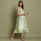 Right View of a Model wearing Olive Green Shibori One-Shoulder Midi Dress