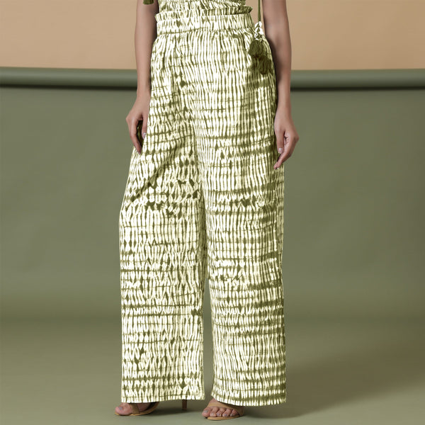 Right View of a Model wearing Olive Green Shibori Paperbag Cotton Pant