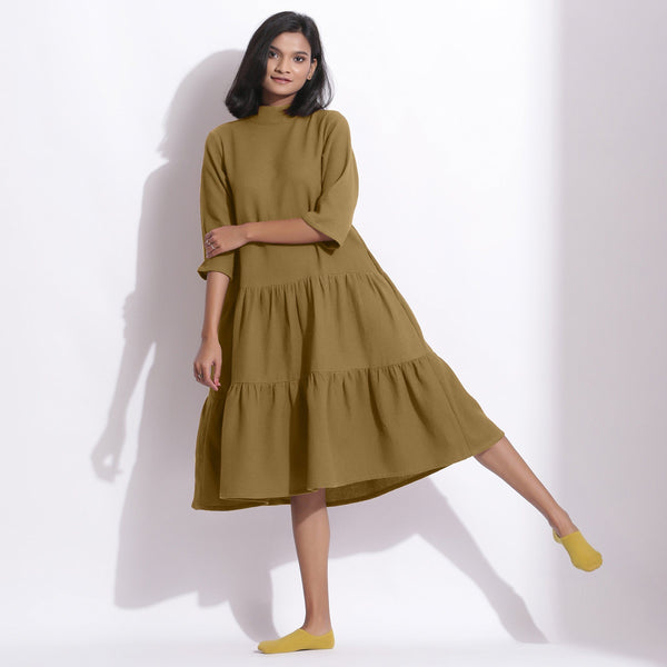 Front View of a Model wearing Olive Green Waffle High Neck Tier Dress
