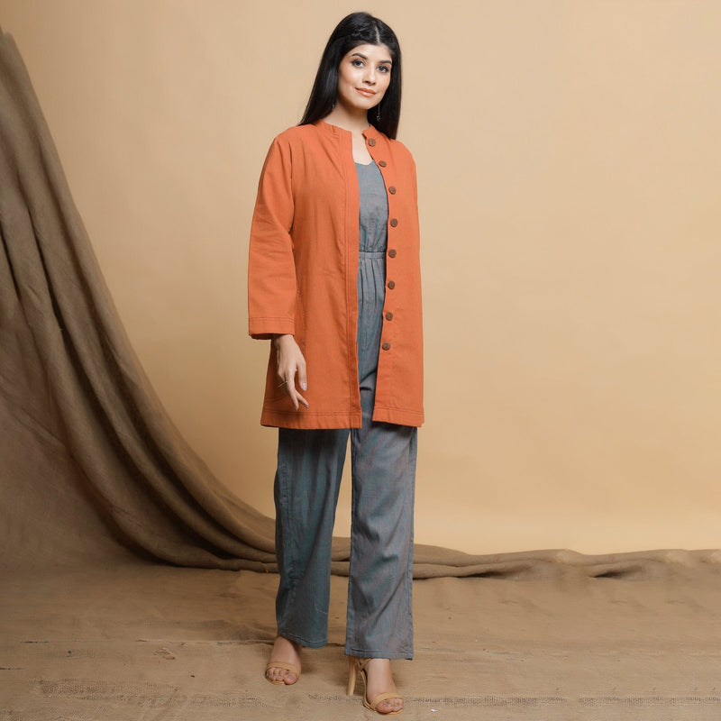 Right View of a Model wearing Orange Cotton High Neck Double Placket Coat
