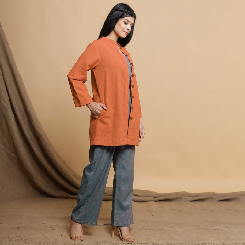 Right View of a Model wearing Orange Cotton High Neck Double Placket Coat