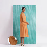 Back View of a Model wearing Orange Comfort Fit Mirror Work Dress