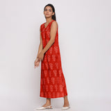 Left View of a Model Wearing Orange Dabu Block Print 100% Cotton Maxi Dress