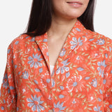 Front Detail of a Model wearing Orange Floral Block Printed Cotton Trench Coat