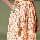 Front Detail of a Model wearing Orange Green Shibori Drop Shoulder Dress