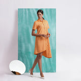 Front View of a Model wearing Orange Mirrored Asymmetrical Shirt Dress