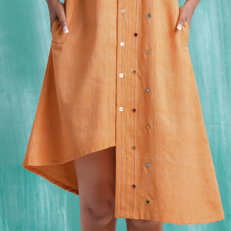 Front Detail of a Model wearing Orange Mirrored Asymmetrical Shirt Dress