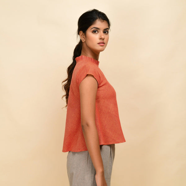 Right View of a Model wearing Orange Ruffled Neck 100% Cotton Flared Top