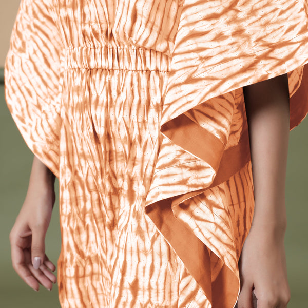 Front Detail of a Model wearing Orange Shibori V-Neck Kaftan Jumpsuit