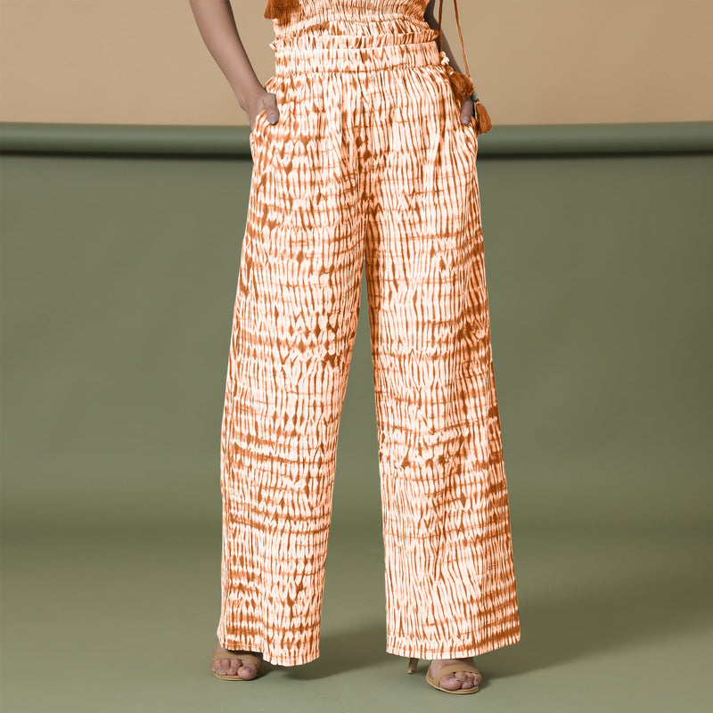 Front View of a Model wearing Orange Shibori Wide Legged Cotton Pant