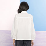 Back View of a Model wearing Organic Cotton Beaded Lace White Shirt