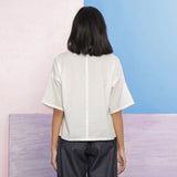 Back View of a Model wearing Organic Cotton Hand Embroidered Paneled Top