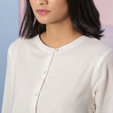 Front Detail of a Model wearing Organic Cotton White Beaded Shirt Dress