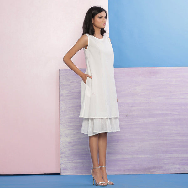 Right View of a Model wearing Organic Cotton White Embroidered A-Line Dress