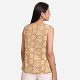Back View of a Model wearing Mustard Paisley Block Print Sleeveless Cotton Top