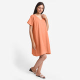 Right View of a Model wearing Peach Cotton Flax V-Neck Tunic