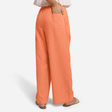 Back View of a Model wearing Peach Cotton Flax Wide Legged Straight Pant