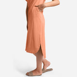 Left View of a Model wearing Peach Cotton Welt Pocket Shift Dress