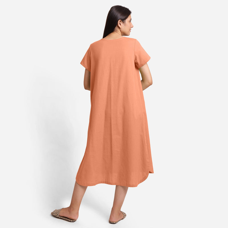 Back View of a Model wearing Peach Cotton Welt Pocket Shift Dress