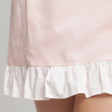 Close View of a Model wearing Peach Cotton Chambray A-Line Skirt