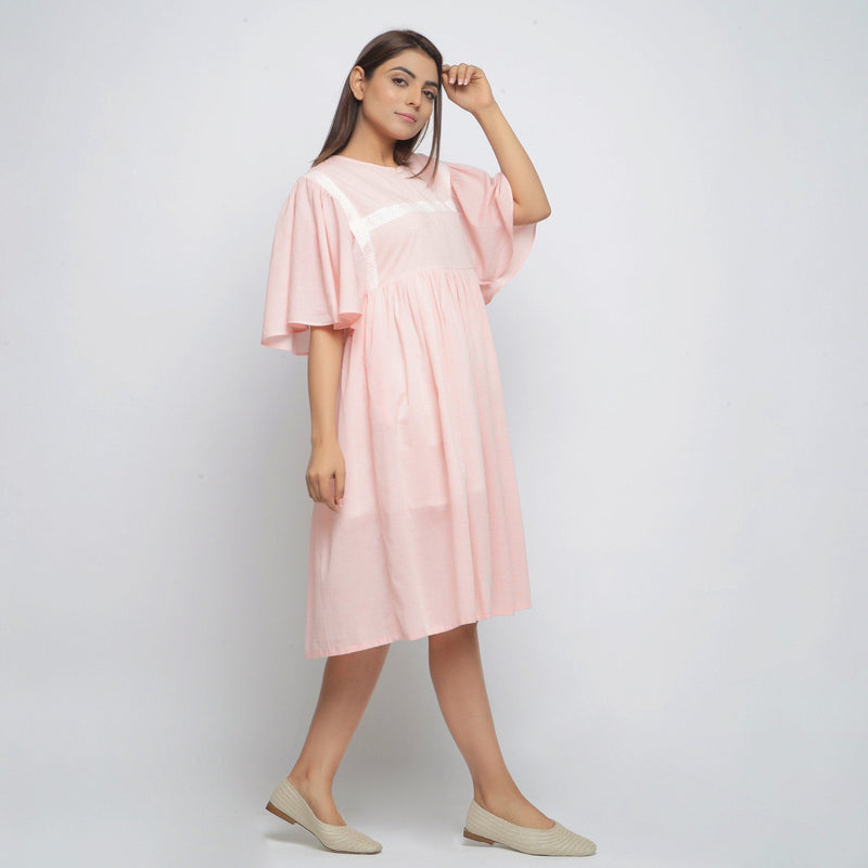 Right View of a Model wearing Peach Lined Cotton Chambray Dress