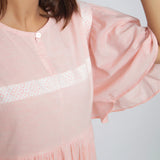 Front Detail of a Model wearing Peach Lined Cotton Chambray Dress