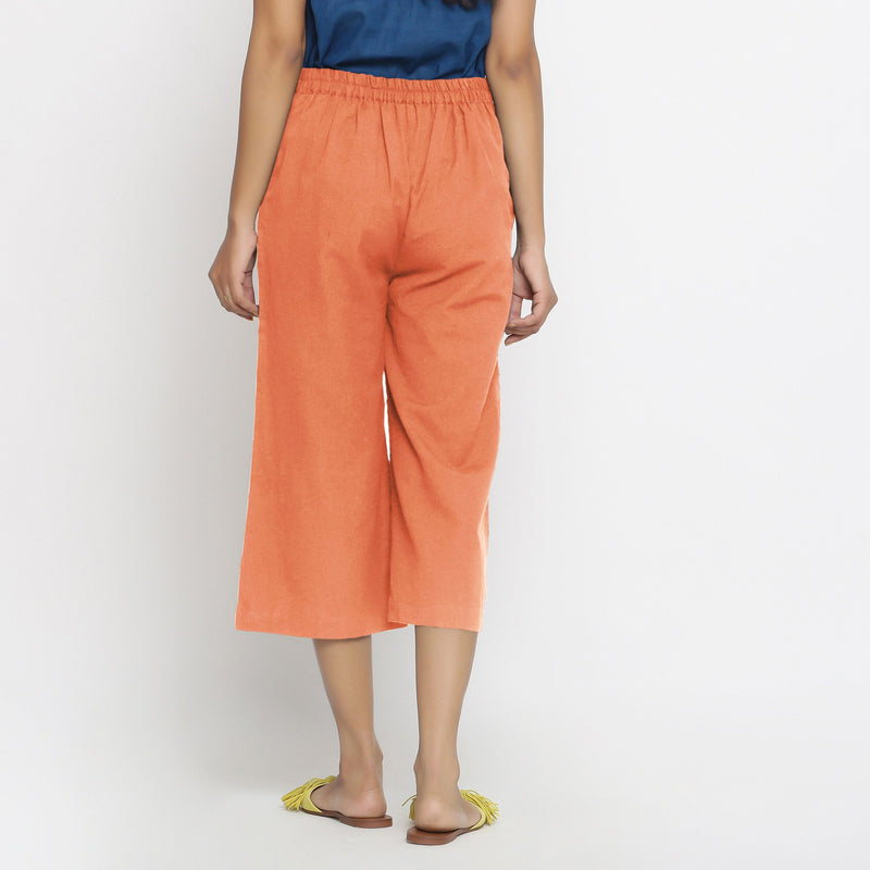 Back View of a Model wearing Peach Mid-Rise Cotton Flax Culottes