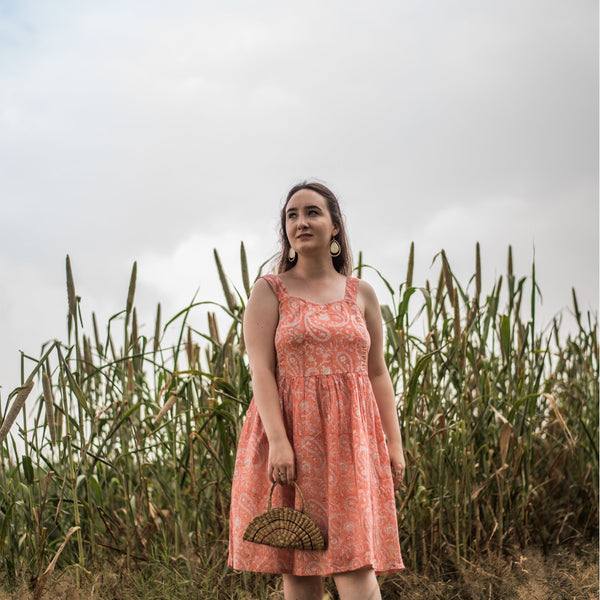 Front View of a Model wearing Peach Paisley Block Print Cotton Knee Length Dress