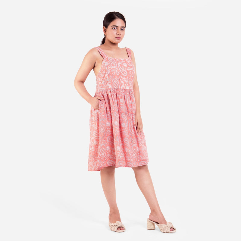 Right View of a Model wearing Peach Paisley Block Print Cotton Knee Length Dress