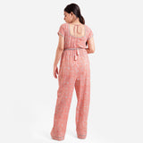 Back View of a Model wearing Peach Block Print Floor Length Cotton Jumpsuit