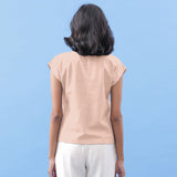 Back View of a Model wearing Peach Vegetable Dyed Handspun Cotton Essential Top