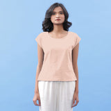 Front View of a Model wearing Peach Vegetable Dyed Handspun Cotton Essential Top
