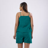 Back View of a Model wearing Pine Green 100% Linen Flared Camisole Top