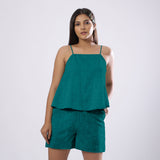 Front View of a Model wearing Pine Green 100% Linen Flared Camisole Top