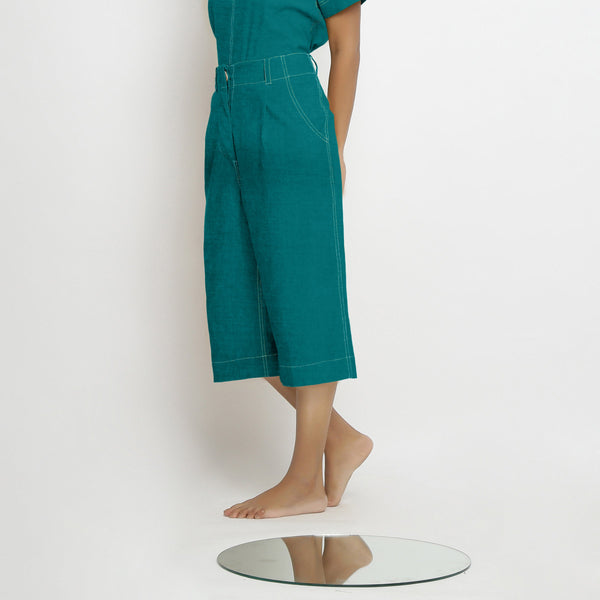 Left View of a Model wearing Pine Green 100% Linen Mid-Rise Culottes