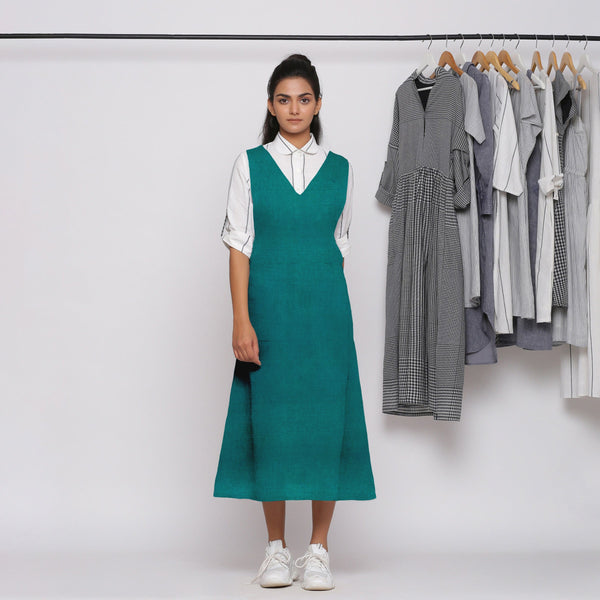 Front View of a Model wearing Pine Green 100% Linen Midi Pinafore Dress