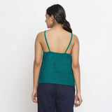 Back View of a Model wearing Solid Pine Green 100% Linen Relaxed Spaghetti Top