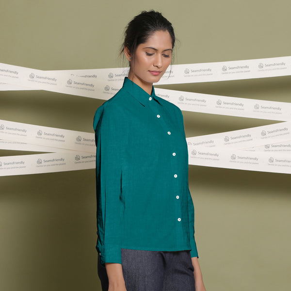 Right View of a Model wearing Solid Pine Green Linen Button-Down Straight Shirt