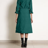 Back View of a Model wearing Warm Pine Green A-Line Frilled Skirt