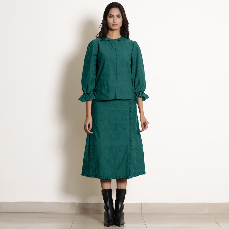 Front View of a Model wearing Pine Green Frilled Top and A-Line Skirt Set