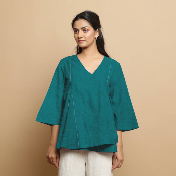 Front View of a Model wearing Pine Green Linen Asymmetrical V-Neck Top
