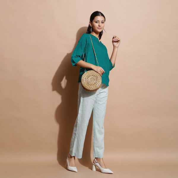 Right View of a Model wearing Pine Green Linen Split-Neck Straight Top
